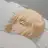 Saber from Fate/stay night sleeping on a white futon under a white blanket